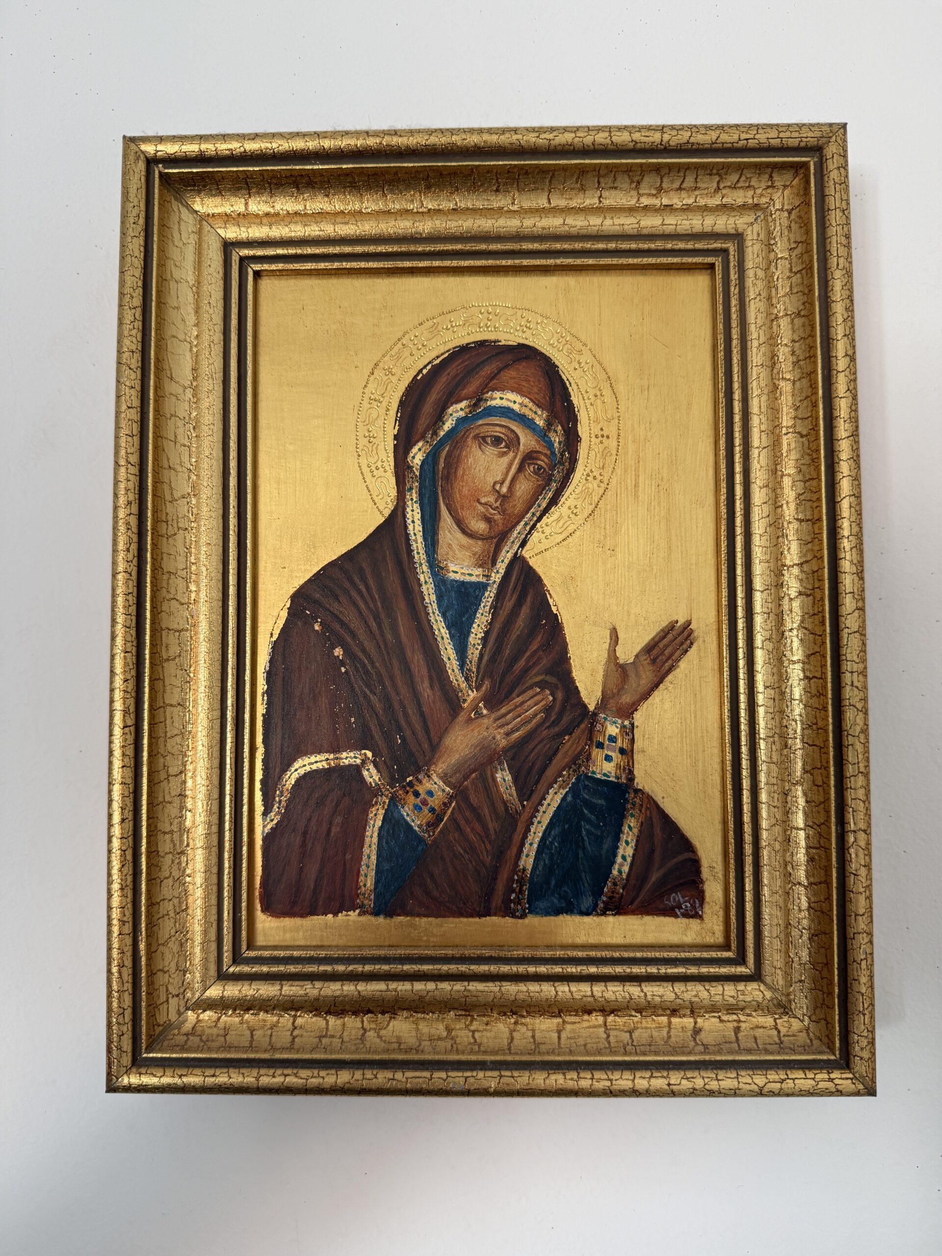 Icono religioso estilo bizantino en marco dorado